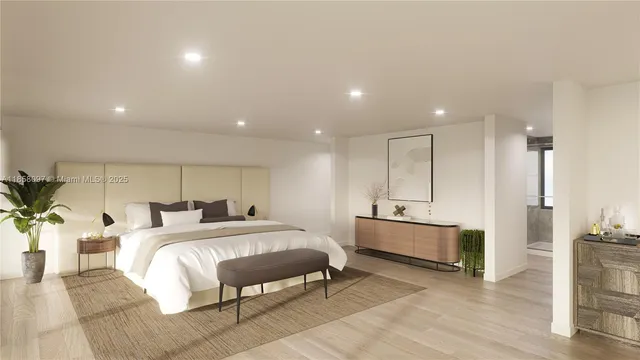 a spacious bedroom with a bed a mirror and desk