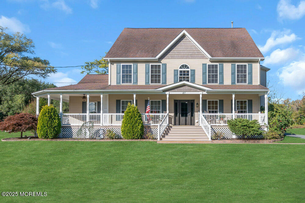 a front view of a house with a yard table and chairs