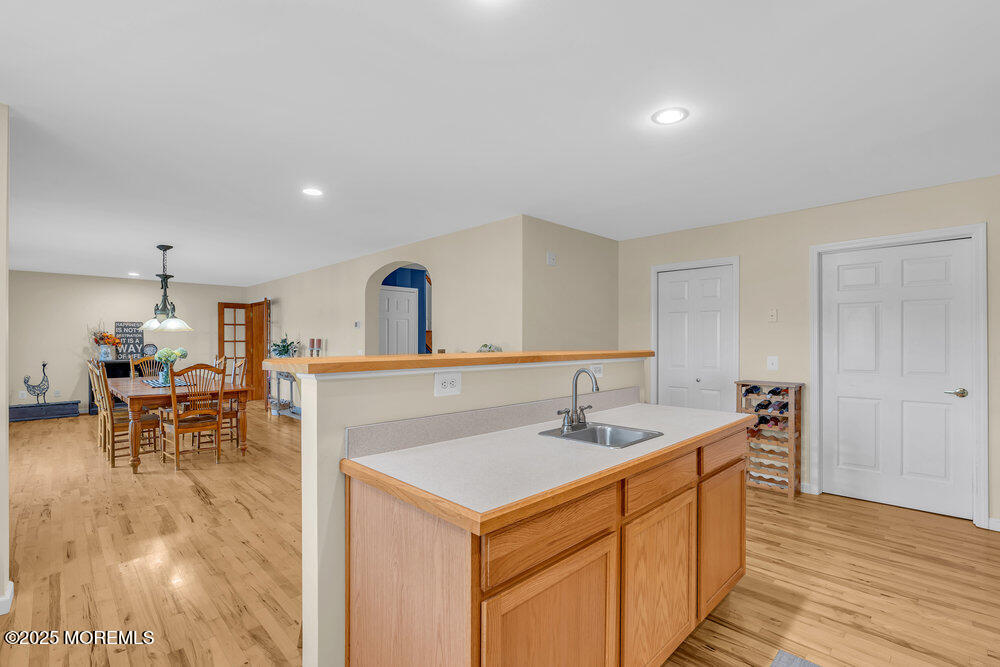 87 Maple Avenue Tuckerton, NJ 08087 - Photo 12 of 48 a kitchen with a sink cabinets and wooden floor
