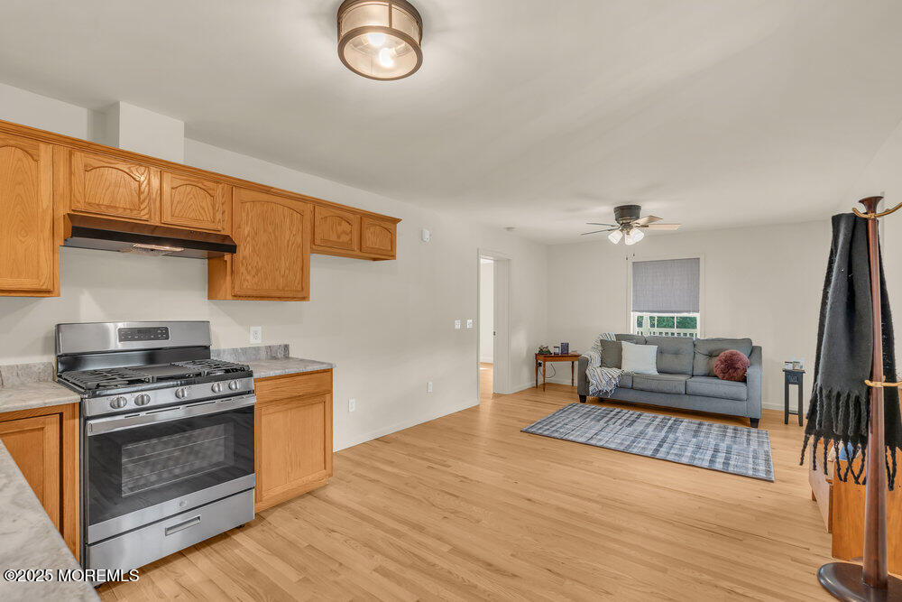 87 Maple Avenue Tuckerton, NJ 08087 - Photo 19 of 48 a kitchen with stainless steel appliances granite countertop a stove and a refrigerator