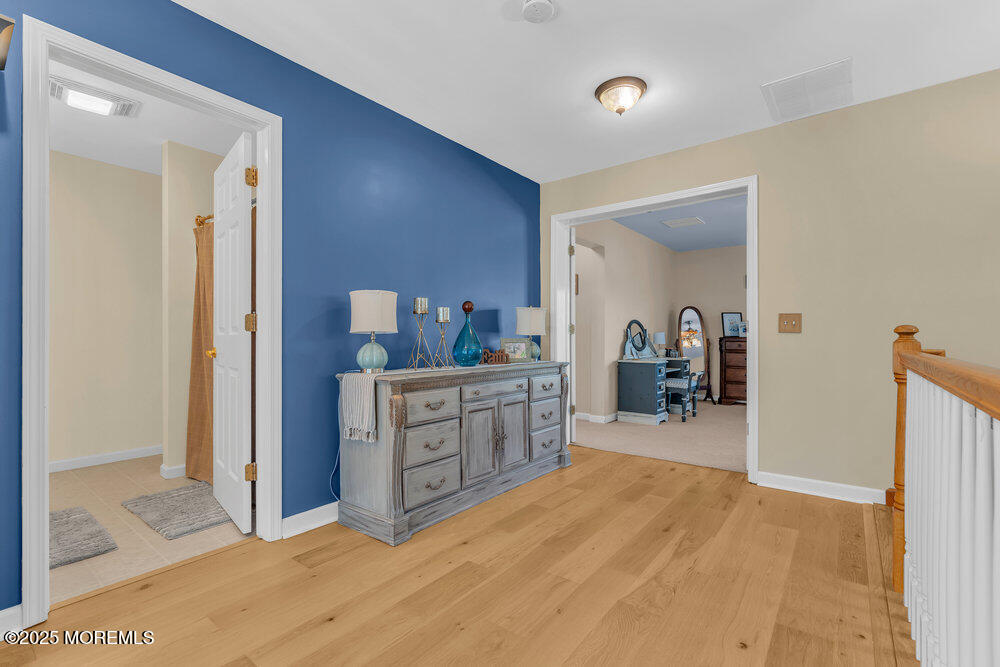 87 Maple Avenue Tuckerton, NJ 08087 - Photo 27 of 48 a room with a bed and a dresser