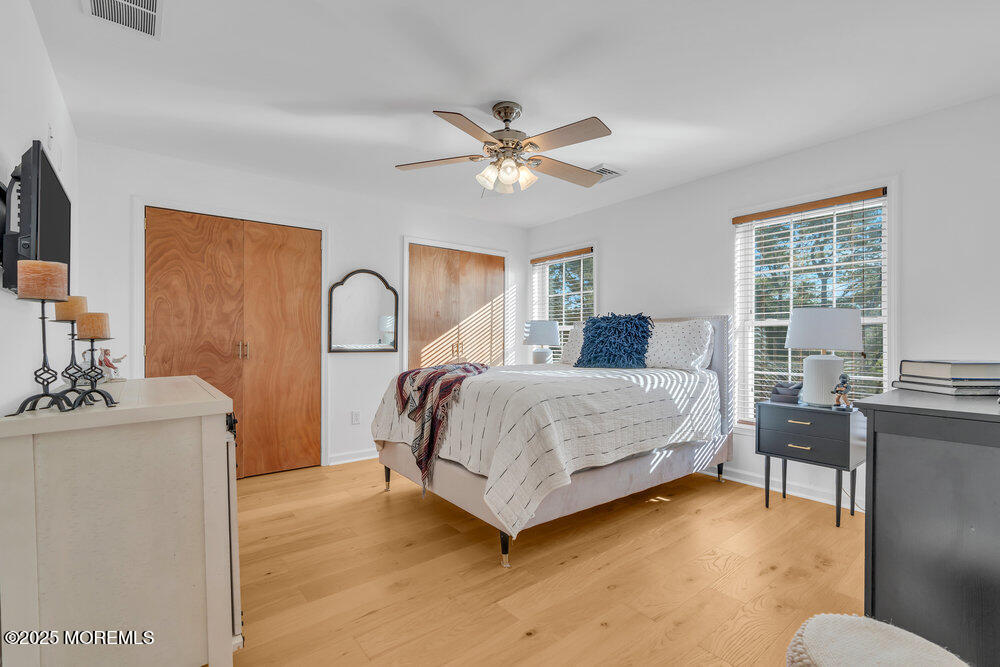 87 Maple Avenue Tuckerton, NJ 08087 - Photo 30 of 48 a spacious bedroom with a bed couch and a window