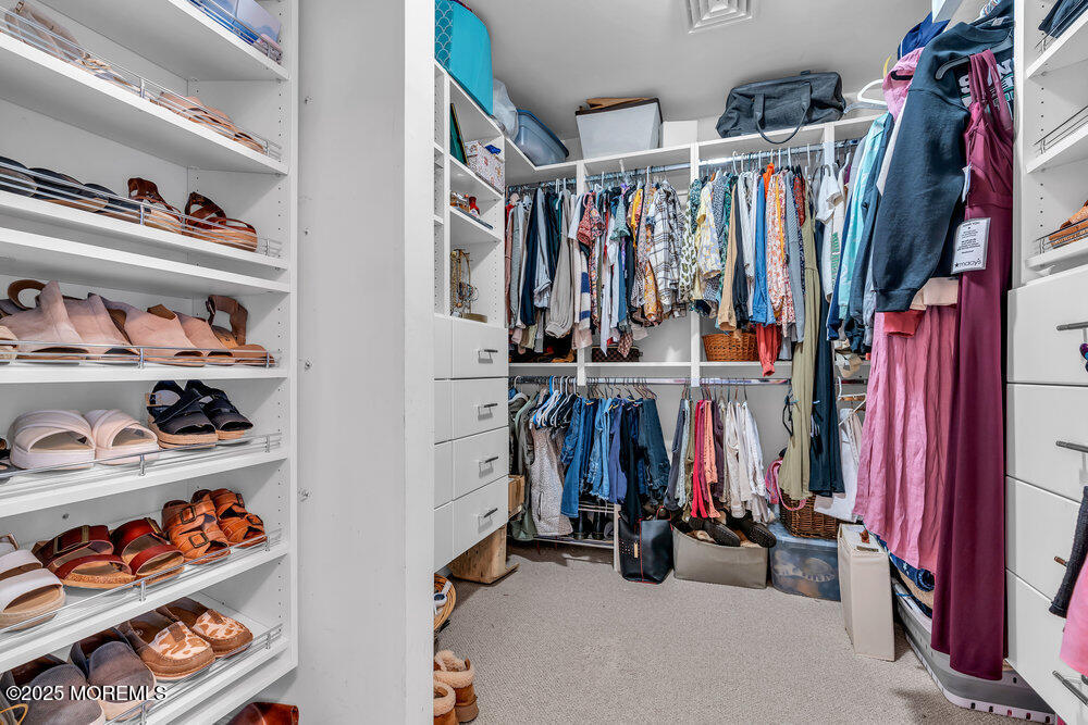 87 Maple Avenue Tuckerton, NJ 08087 - Photo 34 of 48 a view of walk in closet with clothes and shoes