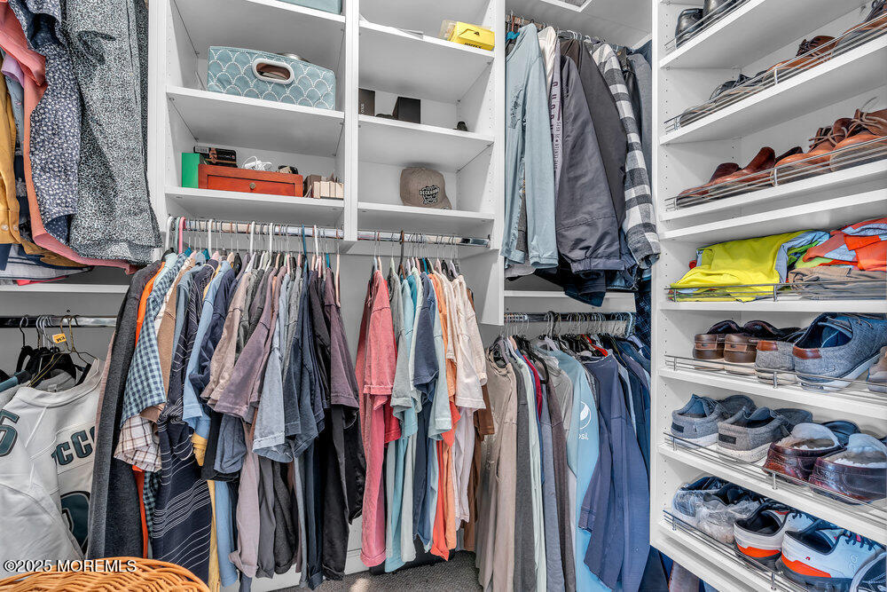 87 Maple Avenue Tuckerton, NJ 08087 - Photo 35 of 48 a view of walk in closet with clothes and shoes
