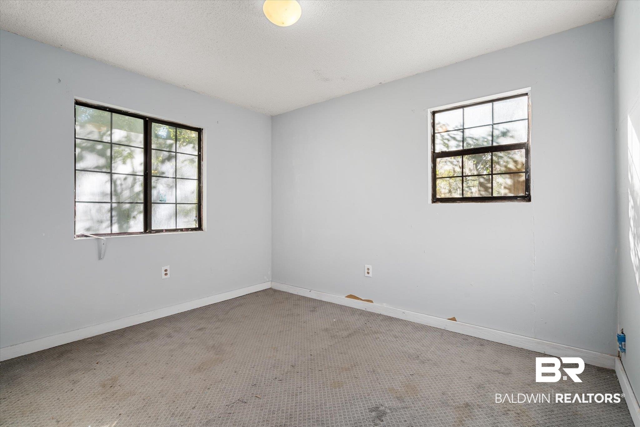 6233 Ponder Road Fairhope, AL 36532 - Photo 15 of 20 Carpeted empty room with a textured ceiling