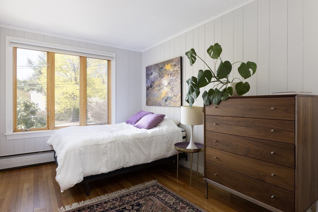 66 Roosevelt Road Newton, MA 02459 - Photo 11 of 17 a bedroom with a bed and a dresser