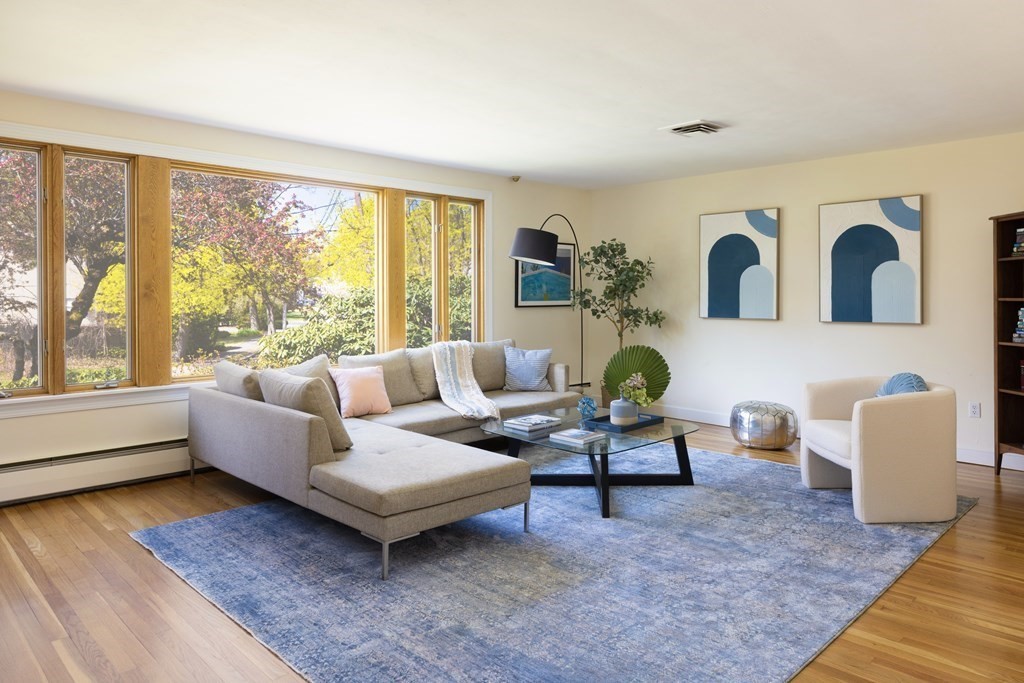 66 Roosevelt Road Newton, MA 02459 - Photo 2 of 17 a living room with furniture and a large window
