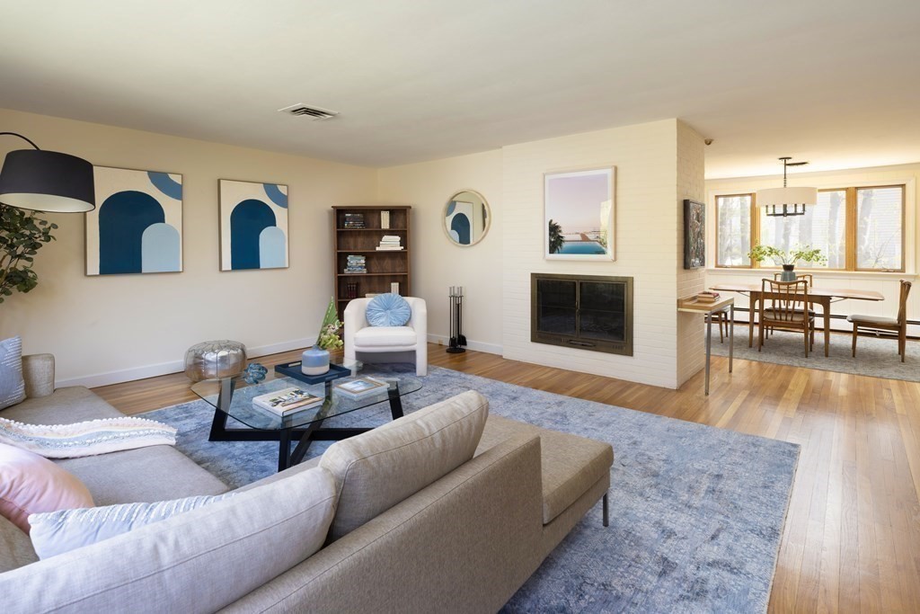 66 Roosevelt Road Newton, MA 02459 - Photo 3 of 17 a living room with furniture and a fireplace