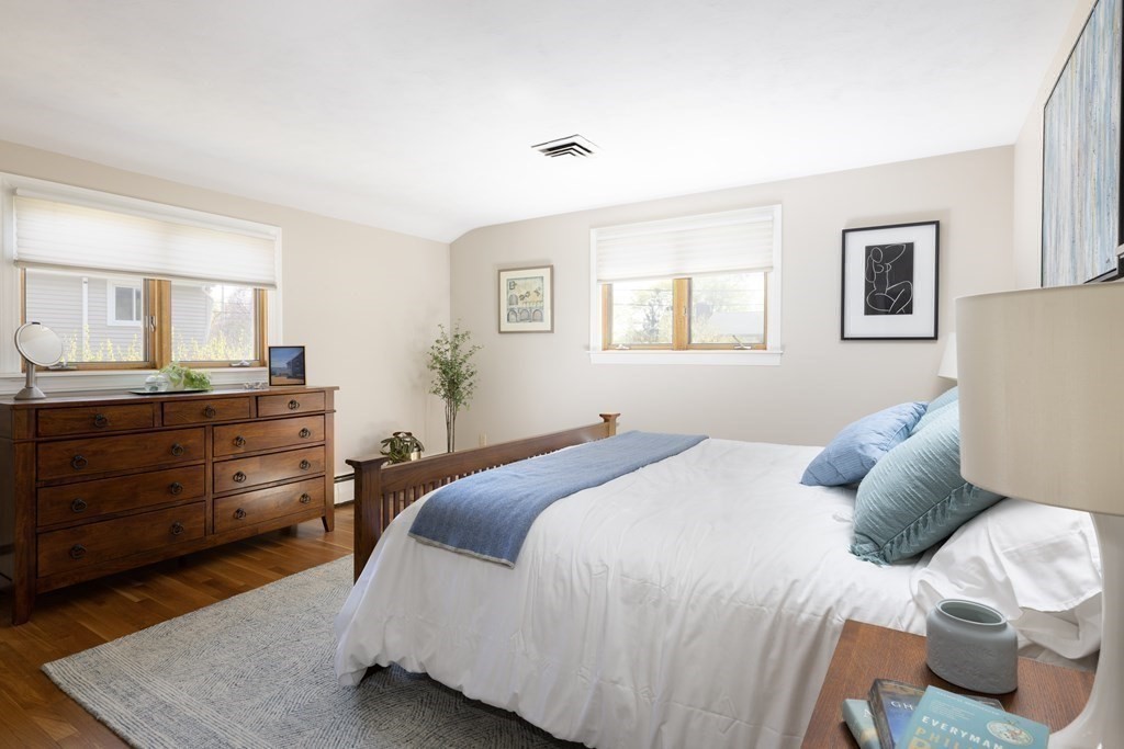 66 Roosevelt Road Newton, MA 02459 - Photo 7 of 17 a bedroom with a bed and a dresser
