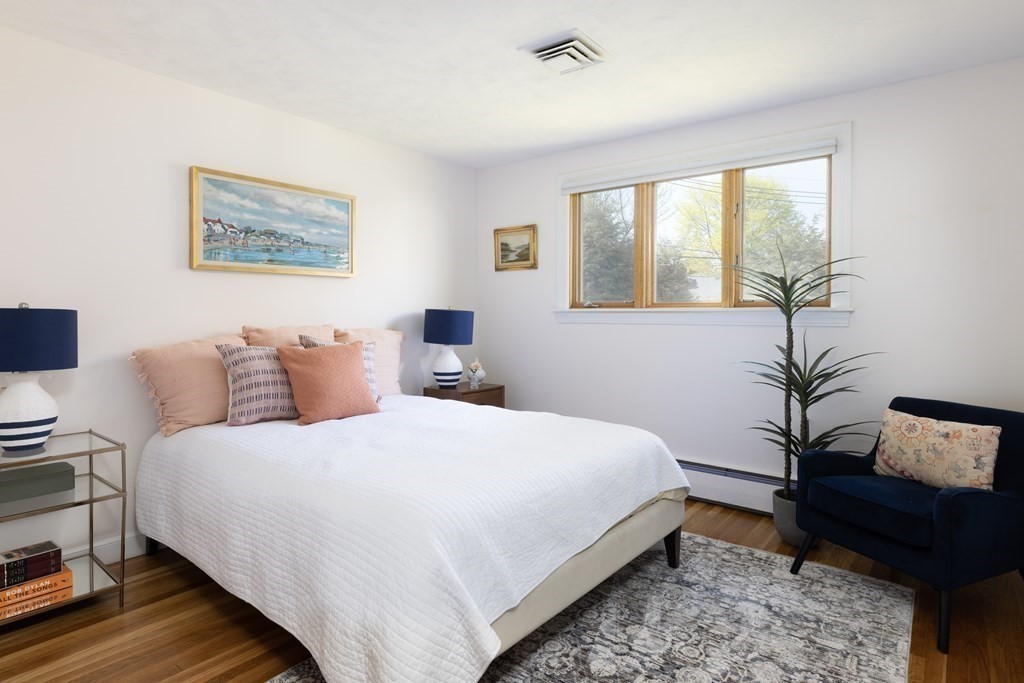 66 Roosevelt Road Newton, MA 02459 - Photo 9 of 17 a bedroom with bed and a potted plant