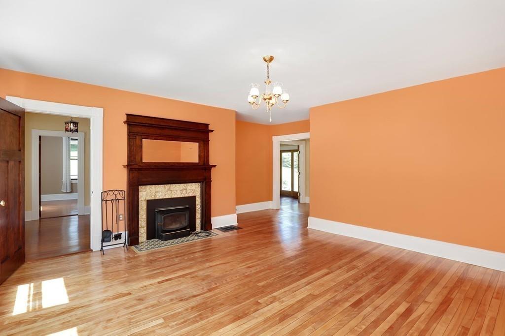 324 Turnpike Road Ashby, MA 01431 - Photo 18 of 41 a view of an empty room with wooden floor fireplace and a window