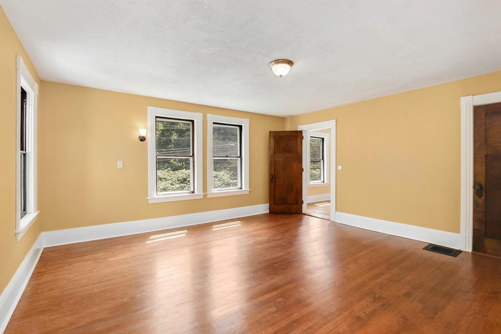 324 Turnpike Road Ashby, MA 01431 - Photo 27 of 41 an empty room with wooden floor and windows