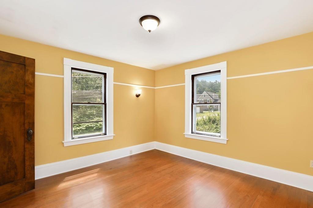 324 Turnpike Road Ashby, MA 01431 - Photo 29 of 41 a view of an empty room with a window and wooden floor