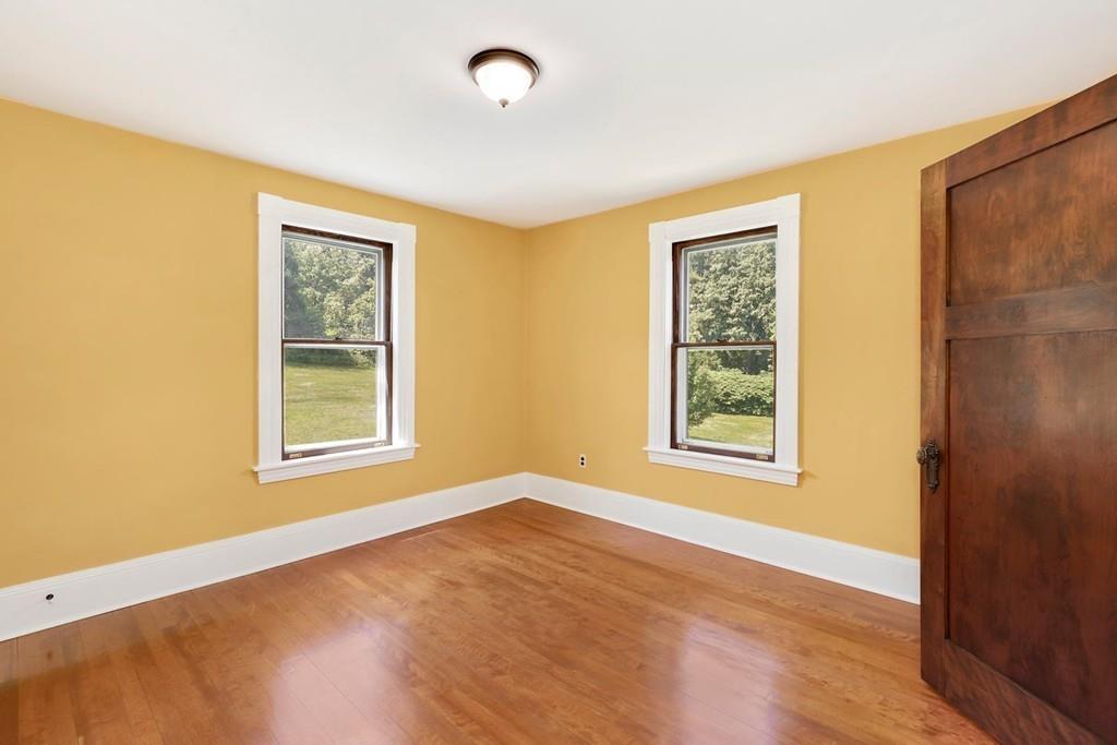 324 Turnpike Road Ashby, MA 01431 - Photo 30 of 41 a view of an empty room with a window and wooden floor