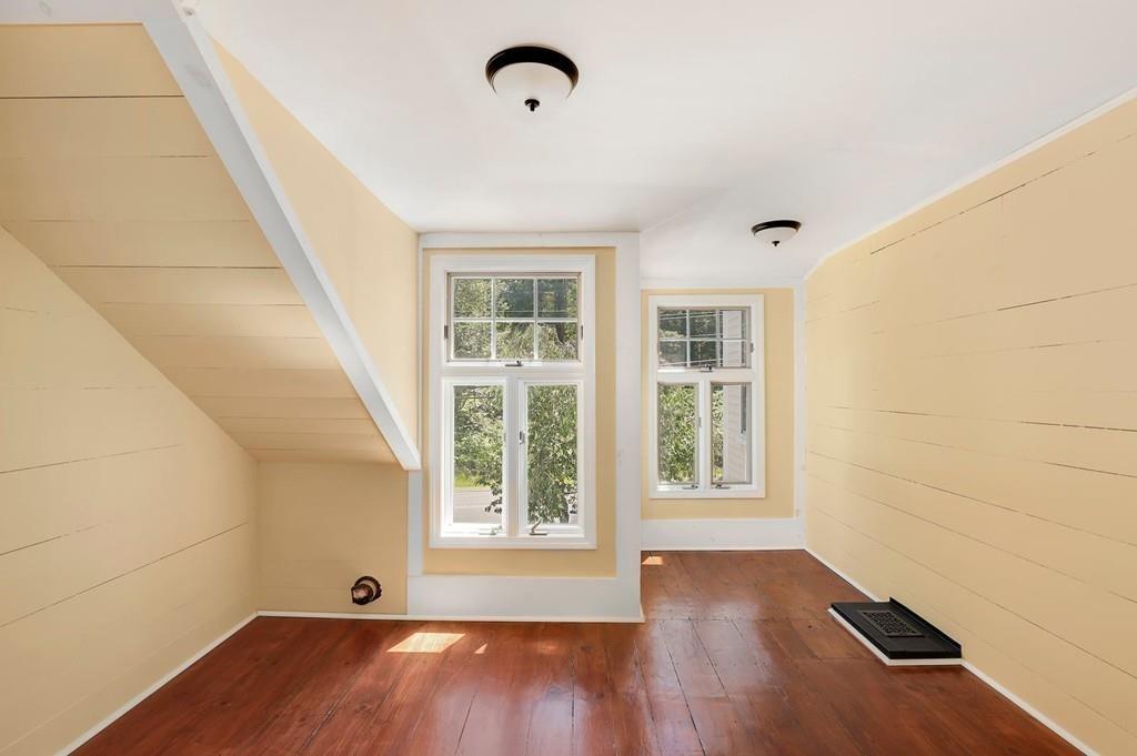 324 Turnpike Road Ashby, MA 01431 - Photo 32 of 41 an empty room with wooden floor and windows