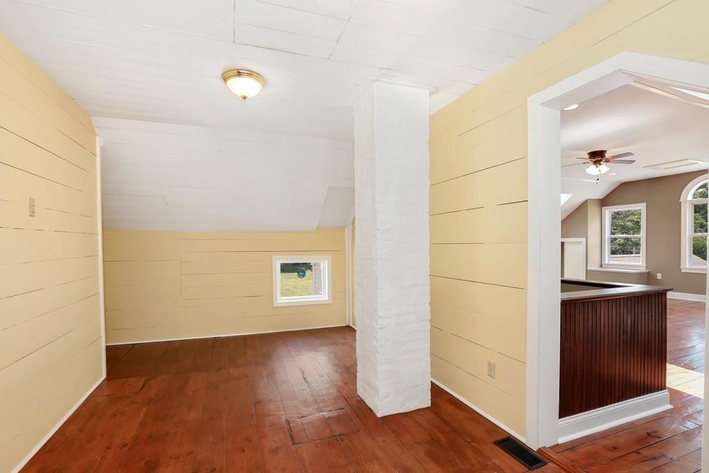 324 Turnpike Road Ashby, MA 01431 - Photo 33 of 41 an empty room with wooden floor and windows