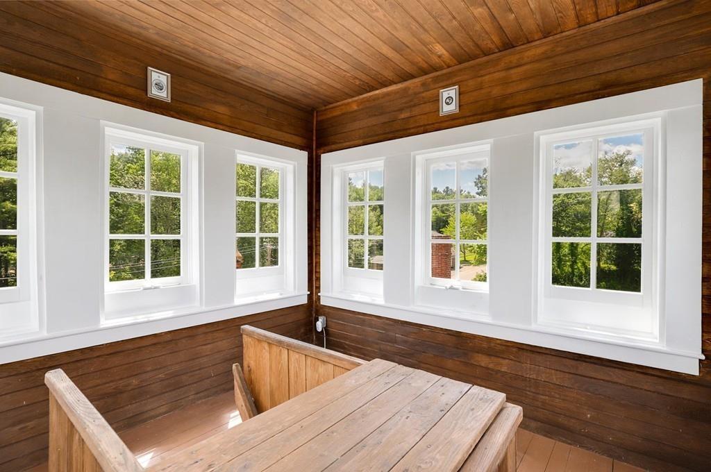 324 Turnpike Road Ashby, MA 01431 - Photo 39 of 41 a view of an outdoor kitchen with wooden floor and a large window