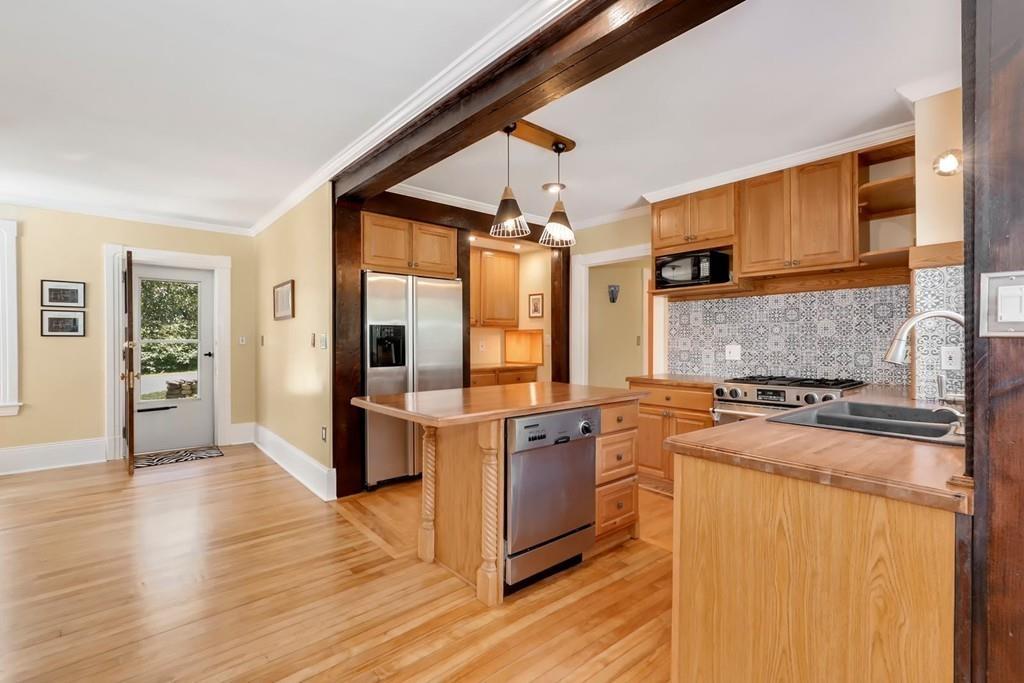324 Turnpike Road Ashby, MA 01431 - Photo 5 of 41 a kitchen with stainless steel appliances granite countertop a stove and refrigerator
