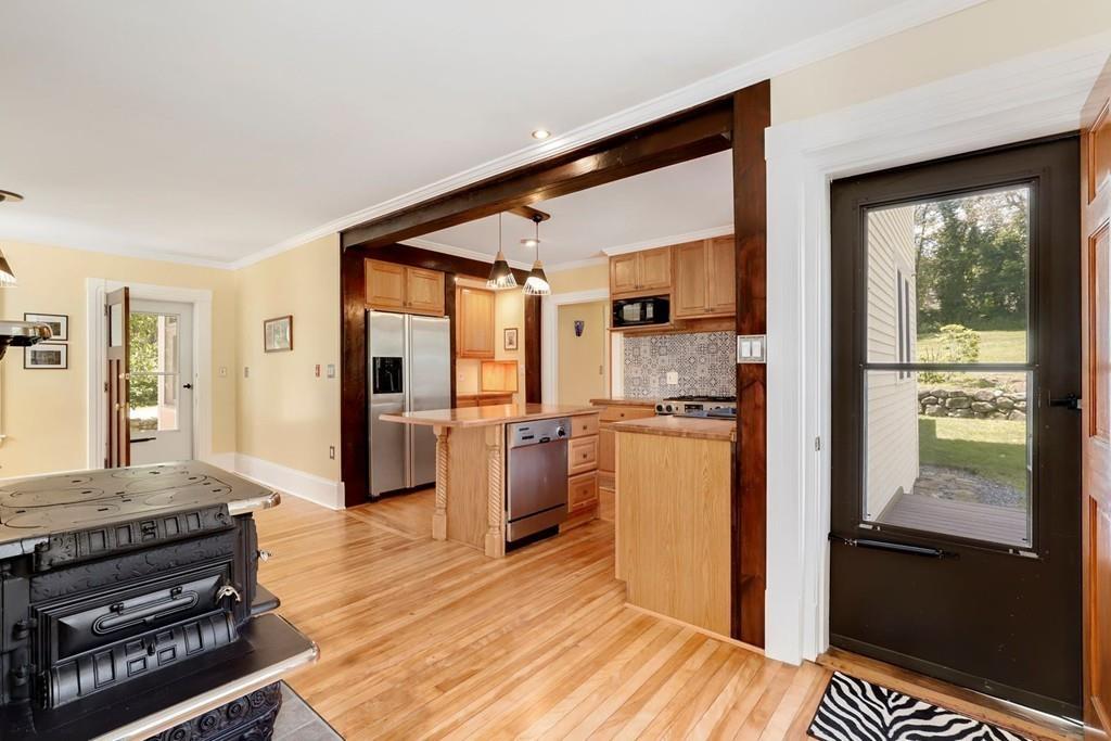 324 Turnpike Road Ashby, MA 01431 - Photo 6 of 41 a kitchen with a refrigerator and a stove top oven