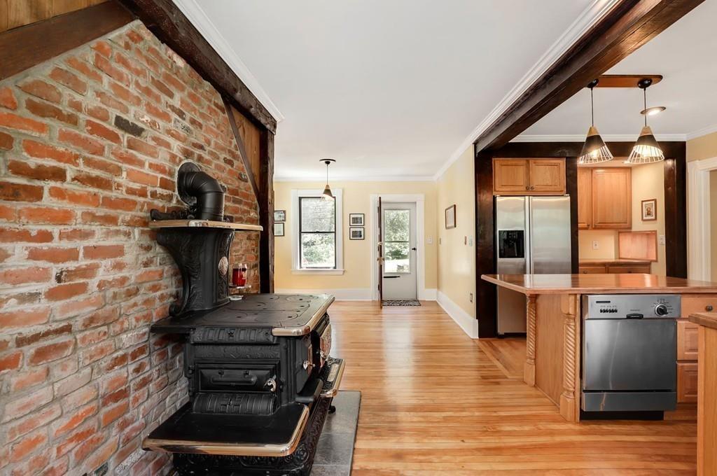 324 Turnpike Road Ashby, MA 01431 - Photo 8 of 41 a kitchen with a stove and a wooden floor