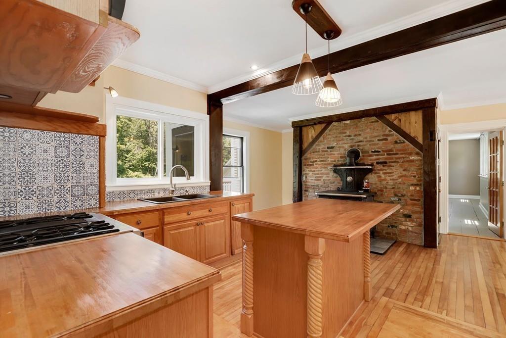 324 Turnpike Road Ashby, MA 01431 - Photo 9 of 41 a kitchen with stainless steel appliances granite countertop a sink stove and refrigerator