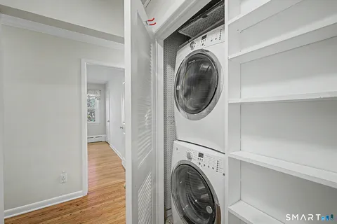 a view of a hallway with washer and dryer
