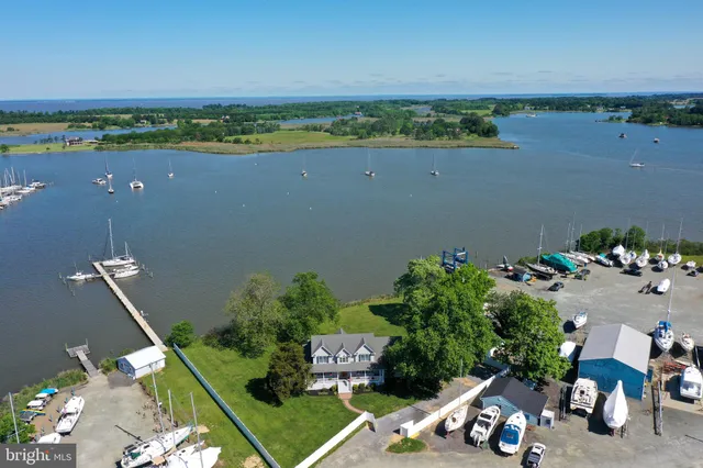 an aerial view of a house with a lake view