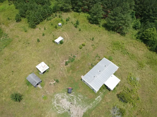 a aerial view of a house with a yard