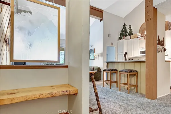 a view of kitchen with furniture and wooden floor