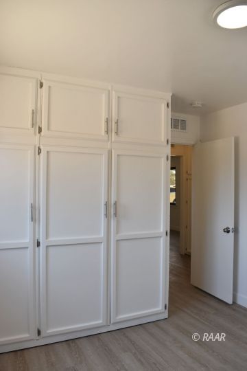 204 North Helena Street Ridgecrest, CA 93555 - Photo 15 of 29 a view of walk in closet with empty racks