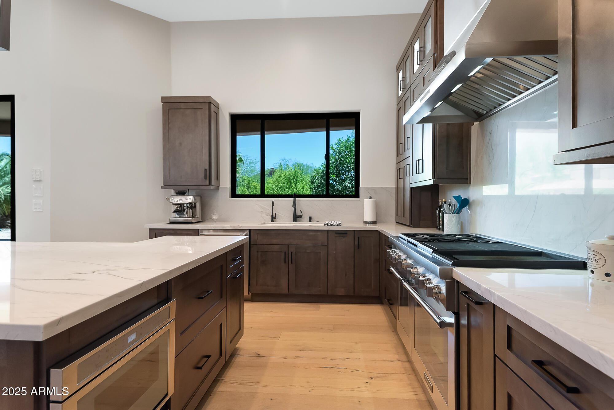 39419 7th Avenue Phoenix, AZ 85086 - Photo 12 of 51 a large kitchen with stainless steel appliances granite countertop a sink and a stove