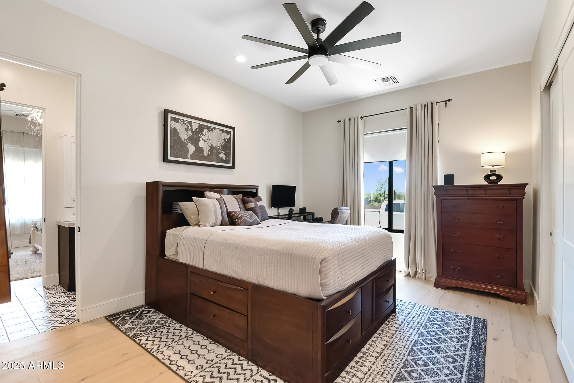 39419 7th Avenue Phoenix, AZ 85086 - Photo 40 of 51 a bedroom with a large bed and a chandelier