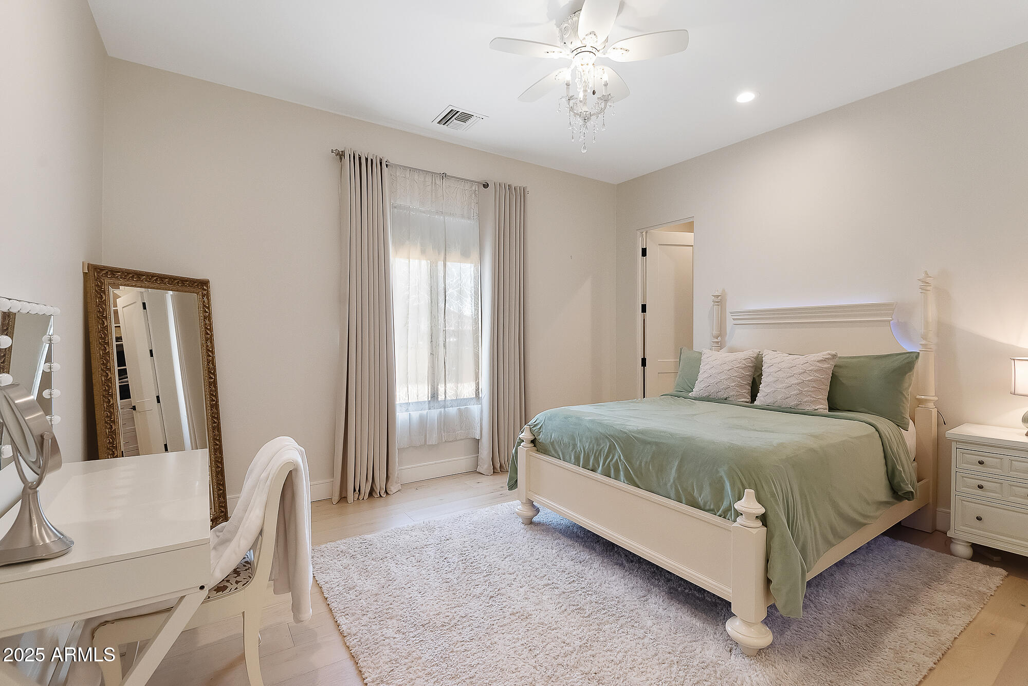 39419 7th Avenue Phoenix, AZ 85086 - Photo 43 of 51 a spacious bedroom with a bed and chair