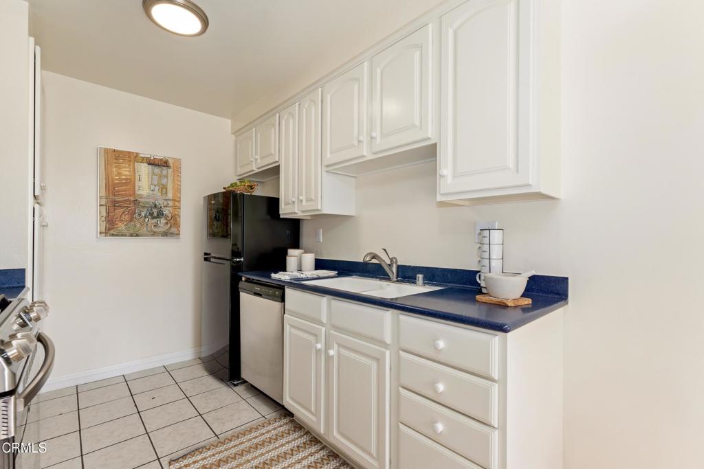 5436 McCulloch Avenue, Unit F Temple City, CA 91780 - Photo 12 of 33 a kitchen with granite countertop white cabinets and stainless steel appliances