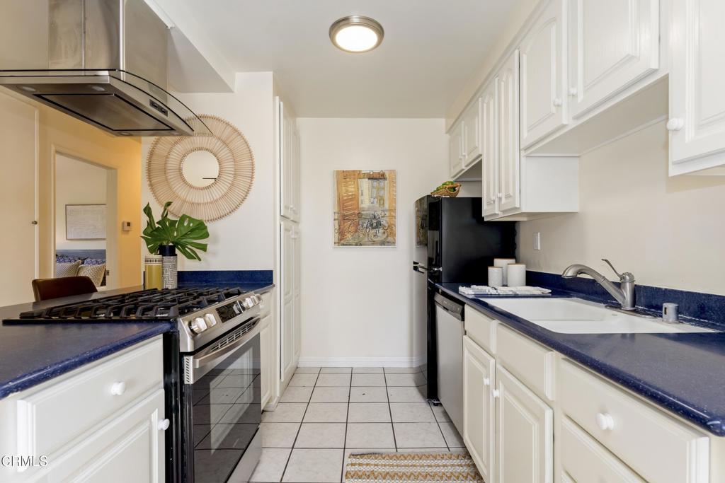5436 McCulloch Avenue, Unit F Temple City, CA 91780 - Photo 13 of 33 a kitchen with stainless steel appliances granite countertop a sink a stove and a refrigerator