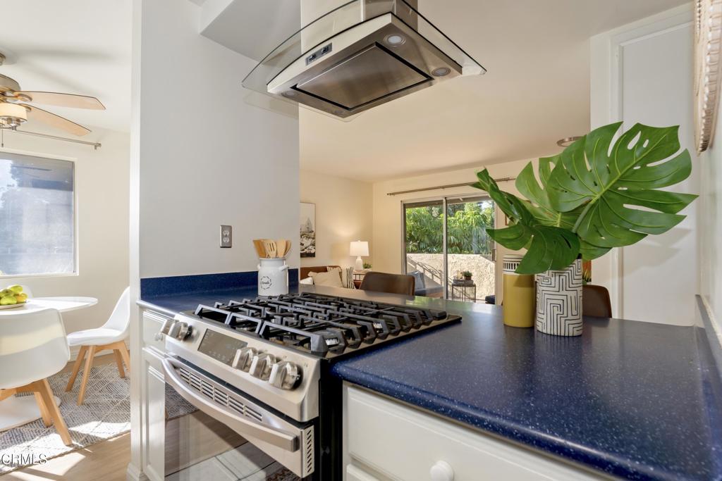 5436 McCulloch Avenue, Unit F Temple City, CA 91780 - Photo 15 of 33 a view of kitchen island with stainless steel appliances stove a table and chairs
