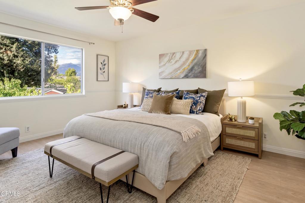 5436 McCulloch Avenue, Unit F Temple City, CA 91780 - Photo 16 of 33 a bedroom with a bed and a chandelier