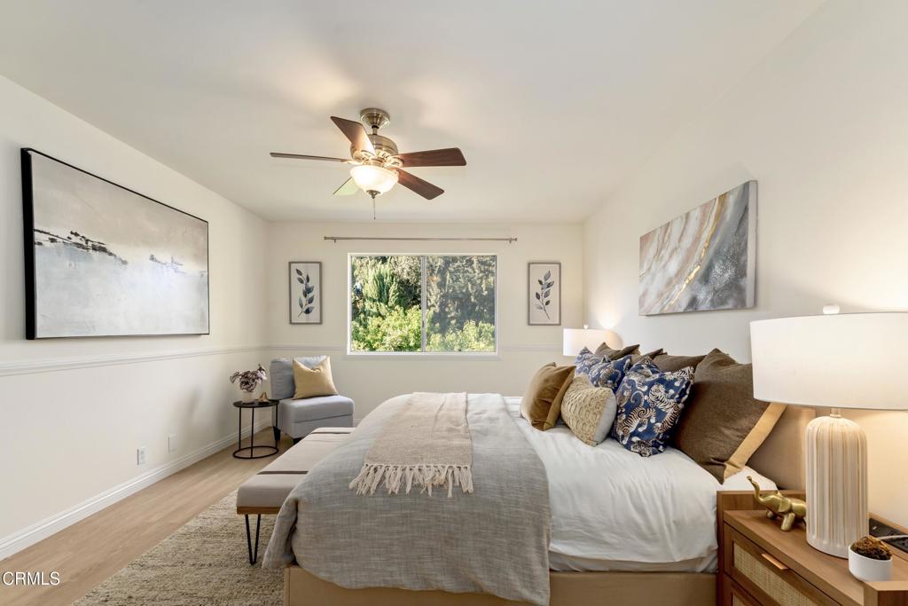5436 McCulloch Avenue, Unit F Temple City, CA 91780 - Photo 17 of 33 a bedroom with a bed and a painting on the wall