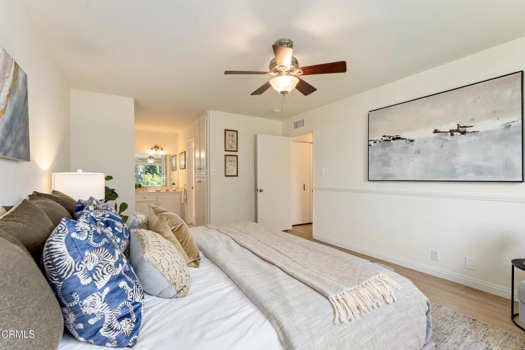 5436 McCulloch Avenue, Unit F Temple City, CA 91780 - Photo 18 of 33 a bedroom with a bed and a chandelier