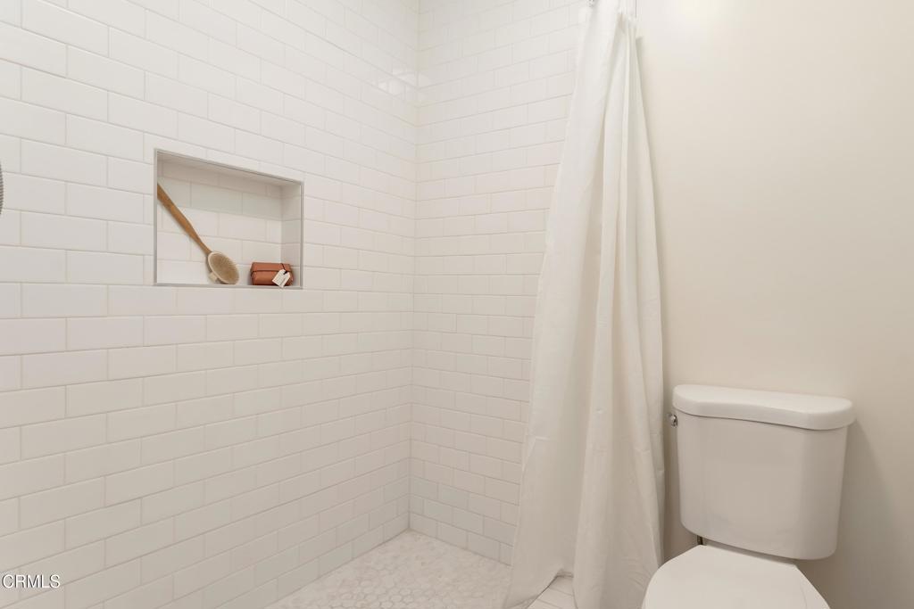 5436 McCulloch Avenue, Unit F Temple City, CA 91780 - Photo 21 of 33 a white toilet sitting next to a shower