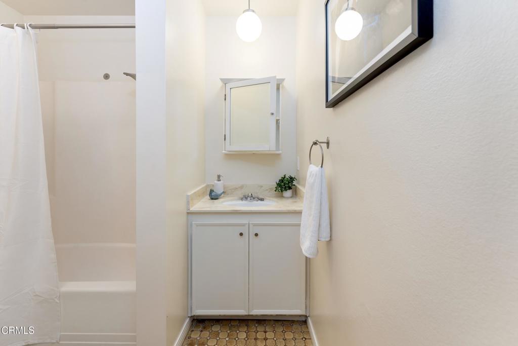 5436 McCulloch Avenue, Unit F Temple City, CA 91780 - Photo 26 of 33 a bathroom with a sink and shower