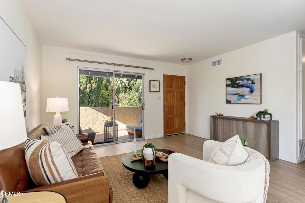 5436 McCulloch Avenue, Unit F Temple City, CA 91780 - Photo 3 of 33 a living room with furniture and a large window