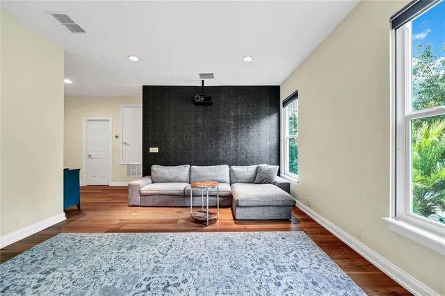 a living room with furniture and a rug