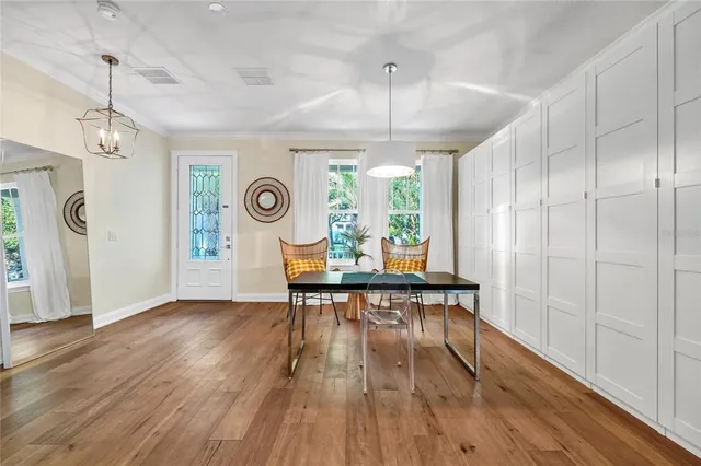 a view of room with window and wooden floor