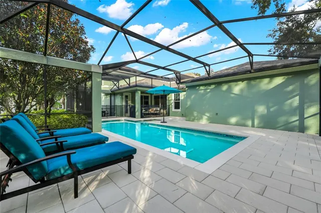 a view of swimming pool with a patio