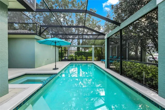 a view of swimming pool with a patio