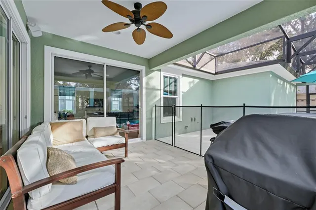 a living room with a ceiling fan