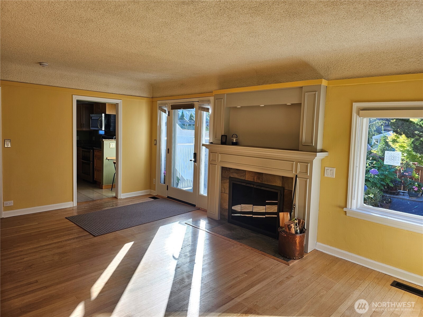 2822 Prosch Avenue West Seattle, WA 98119 - Photo 12 of 31 a living room with furniture and a fireplace