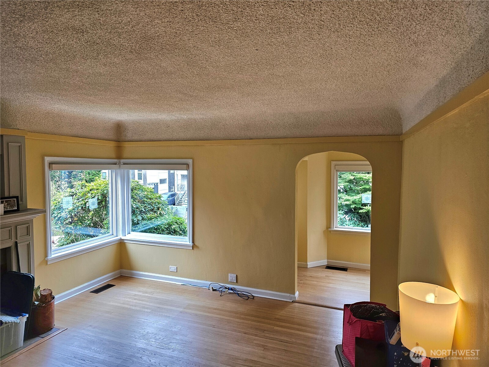 2822 Prosch Avenue West Seattle, WA 98119 - Photo 13 of 31 a view of an empty room with wooden floor and a window