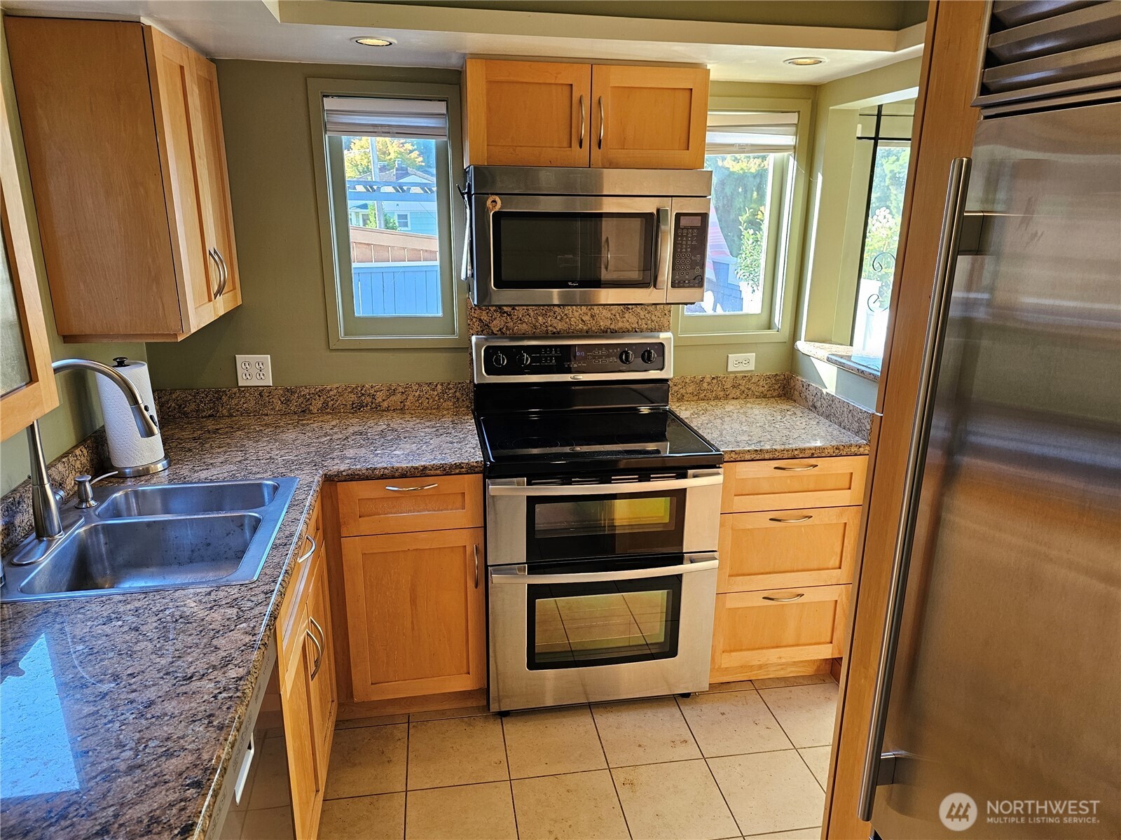 2822 Prosch Avenue West Seattle, WA 98119 - Photo 14 of 31 a kitchen with granite countertop a stove and a microwave